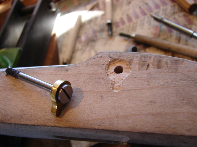 The hole with the first layer of wood removed.