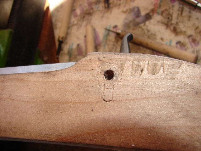 Using your chisels, cut along the scribe line.